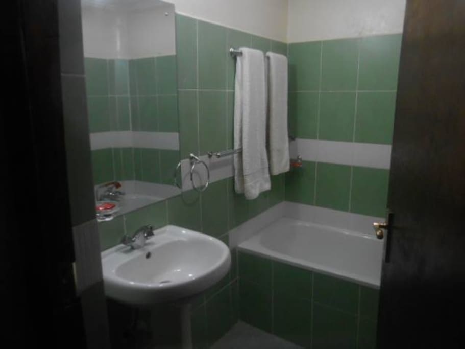 Both bathrooms have bathtub with shower