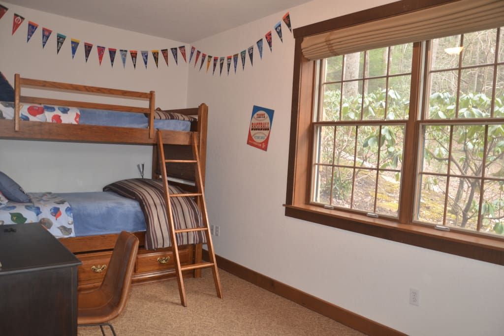 The bunk room contains 2 beds, a desk and a comfy reading chair. Room for additional air mattresses, if needed