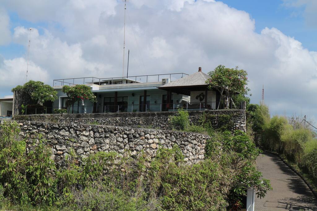 Back view of Gaia Villa's terrace, swimming pool and gazebo from the cliff