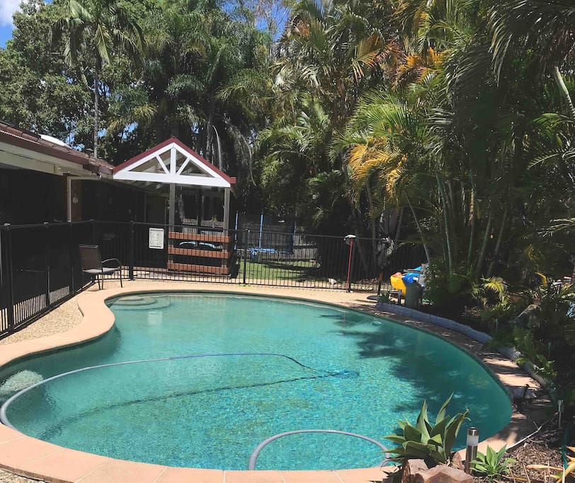 View from end of the pool back to the deck. Outdoor BBQ for that afternoon family time.