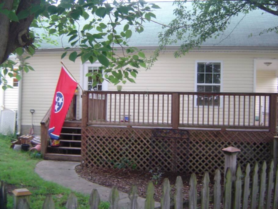 View of the side of the house and the large porch.