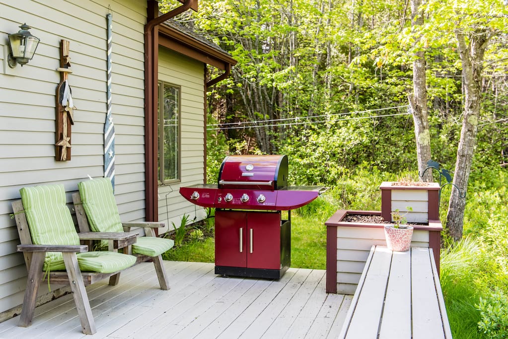 Just a small part of the large deck with picnic table, numerous seating and grill overlooking Denning Brook.