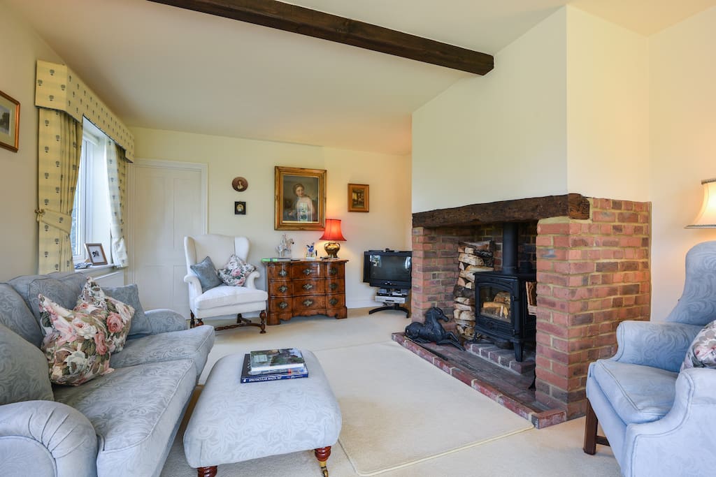 The Sitting room is equipped with a log burning stove