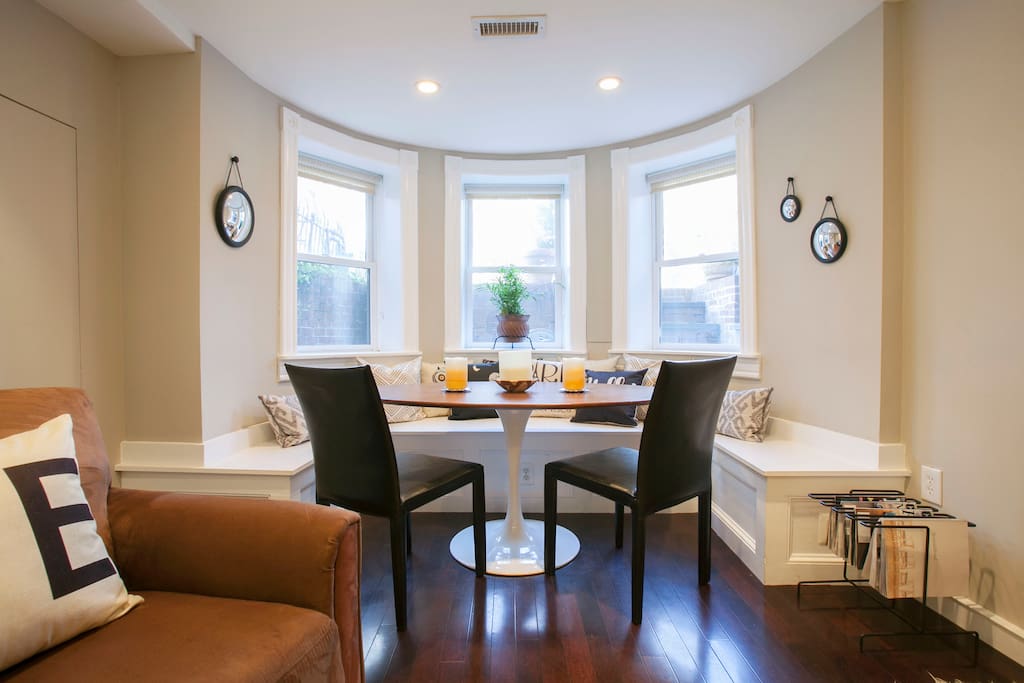 Dining area in bay window seats six. Great spot for working, too!
