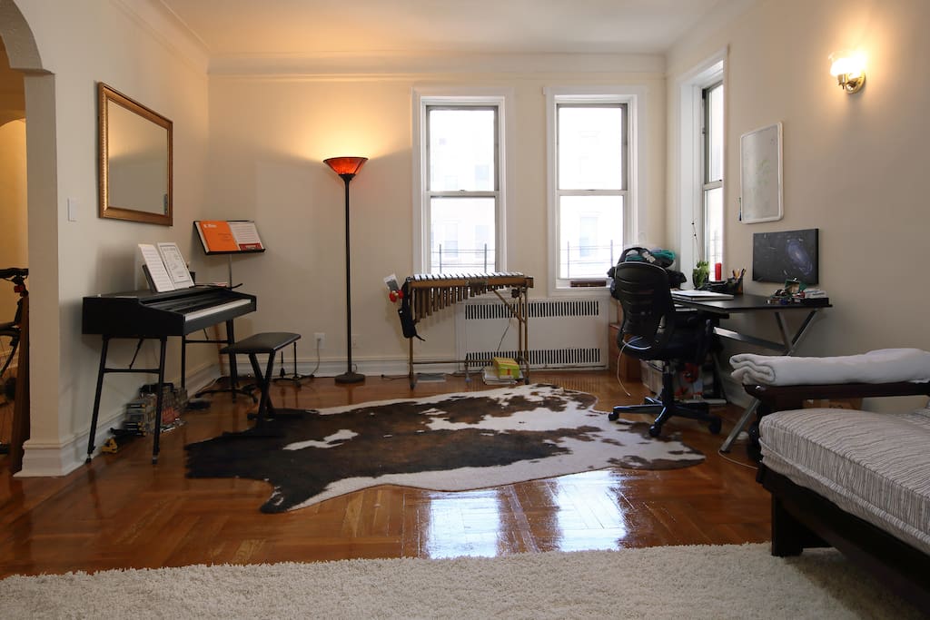 Living room/office/music space. Lots of natural light. Electric piano and vibraphone can be used, just please don't out any food or drinks on the musical instruments (...and we're a vegetarian family, so of course, that's faux-cow hide).