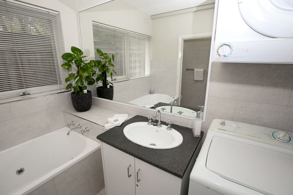 Bathroom with spa bath and full laundry facilities
