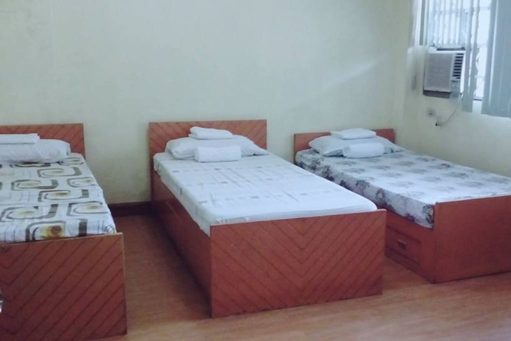 private room, 3 single beds, with private toilet and bath, comes with breakfast