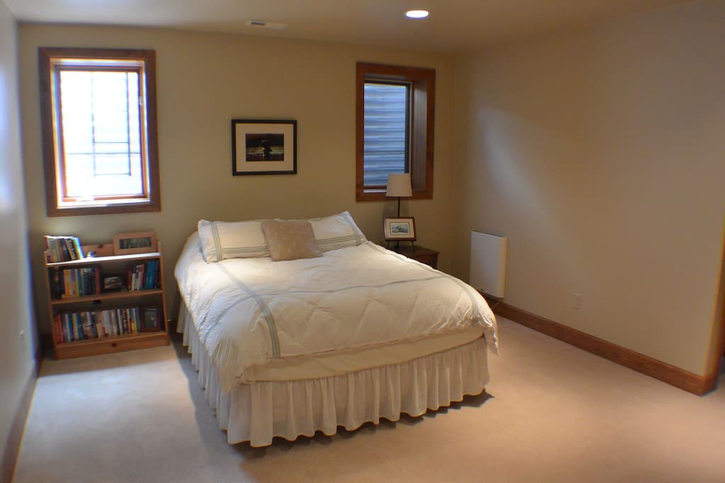 Queen size bed in spacious suite
