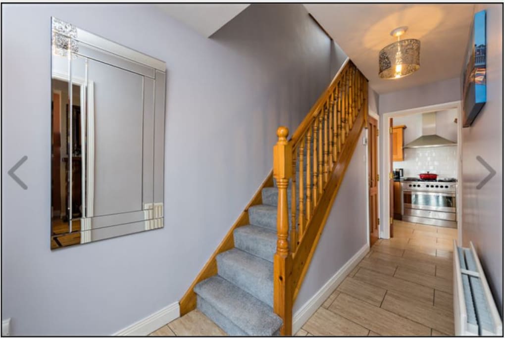 Hallway leading to kitchen, living room door is on the right