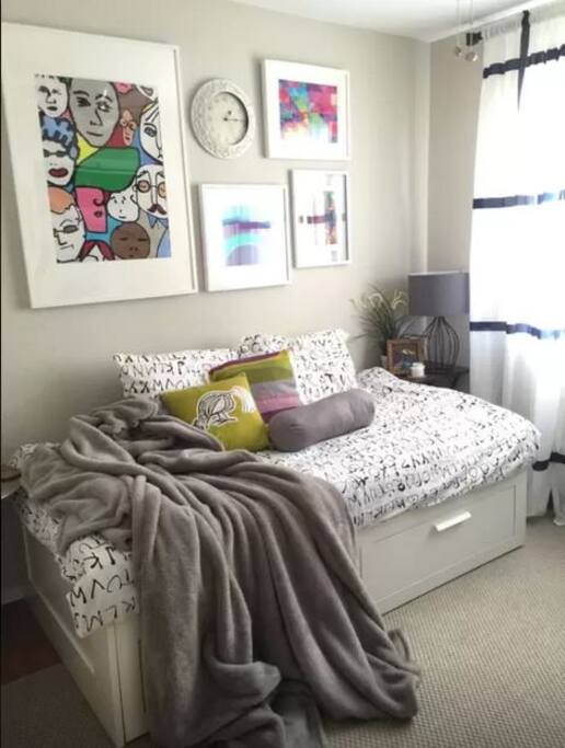 This room features a day bed that pulls out into a king-sized bed. Comes with fresh sheets, memory foam pillows, a plush blanket, a custom-built desk and a large window that bring plenty of natural light into the space.
