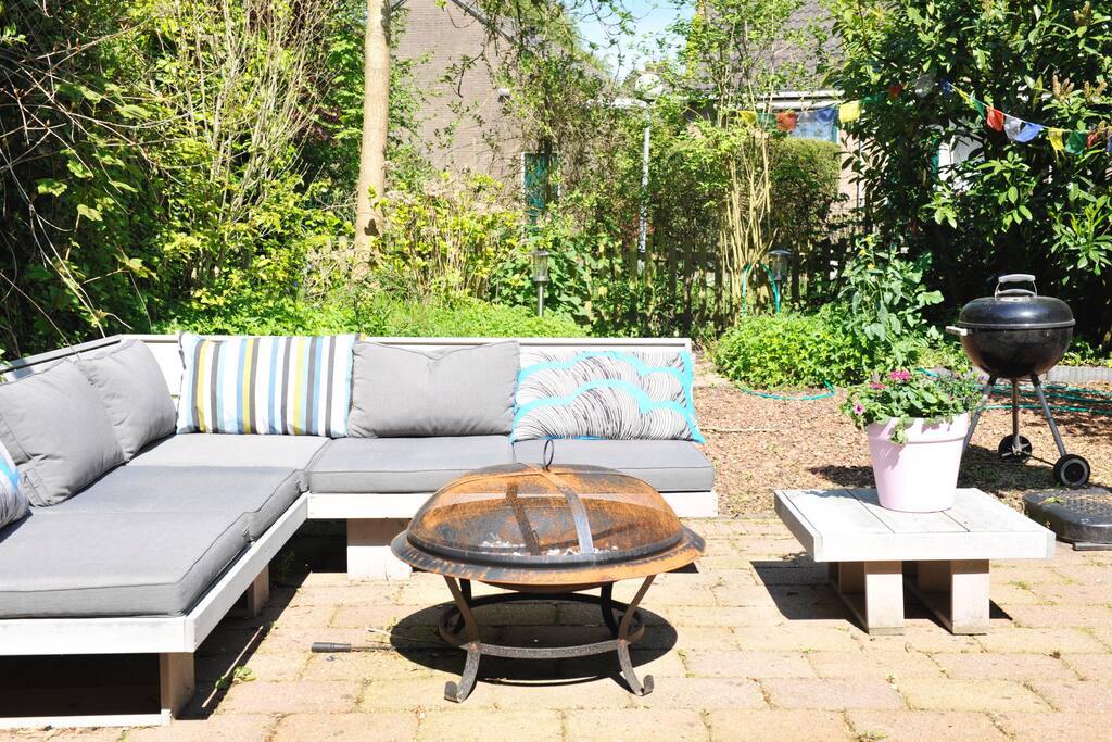 Sunny private garden with lounge set