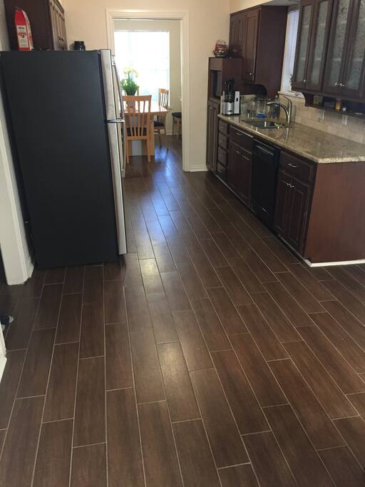 Spacious kitchen equipped with all cooking and dining necessities.