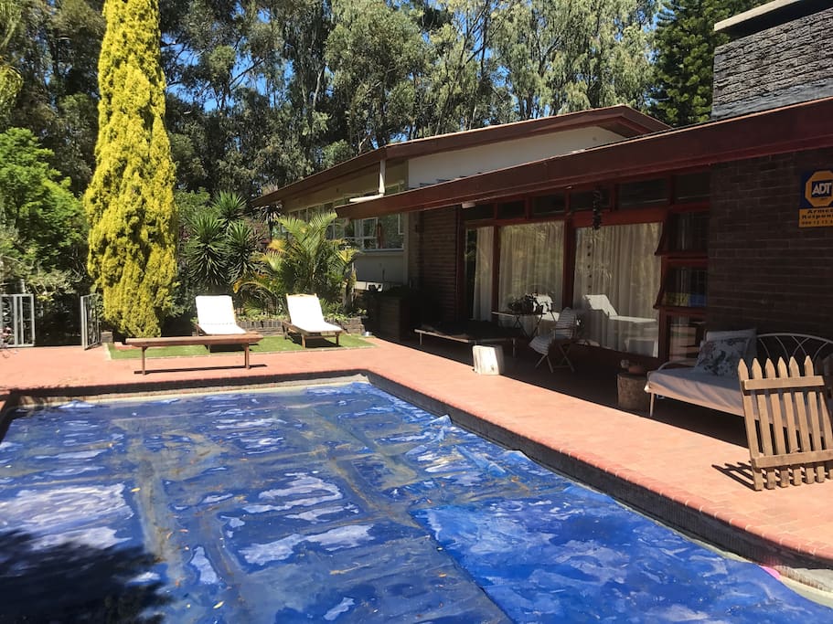 Swimminpool and tanning area. The cover is on the pool for water saving.