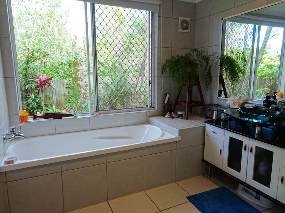 Nice big bath, two(!) showers and another shower of green out the window. Separate loo.