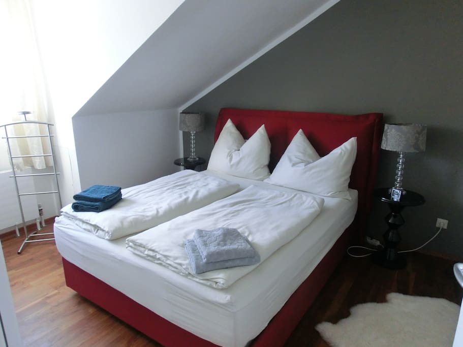 A comfortable box spring-bed in the master bed room