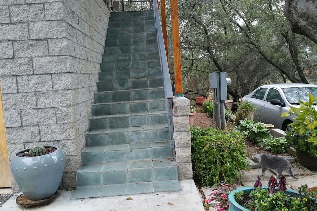 Parking adjacent to stairs up to the guesthouse