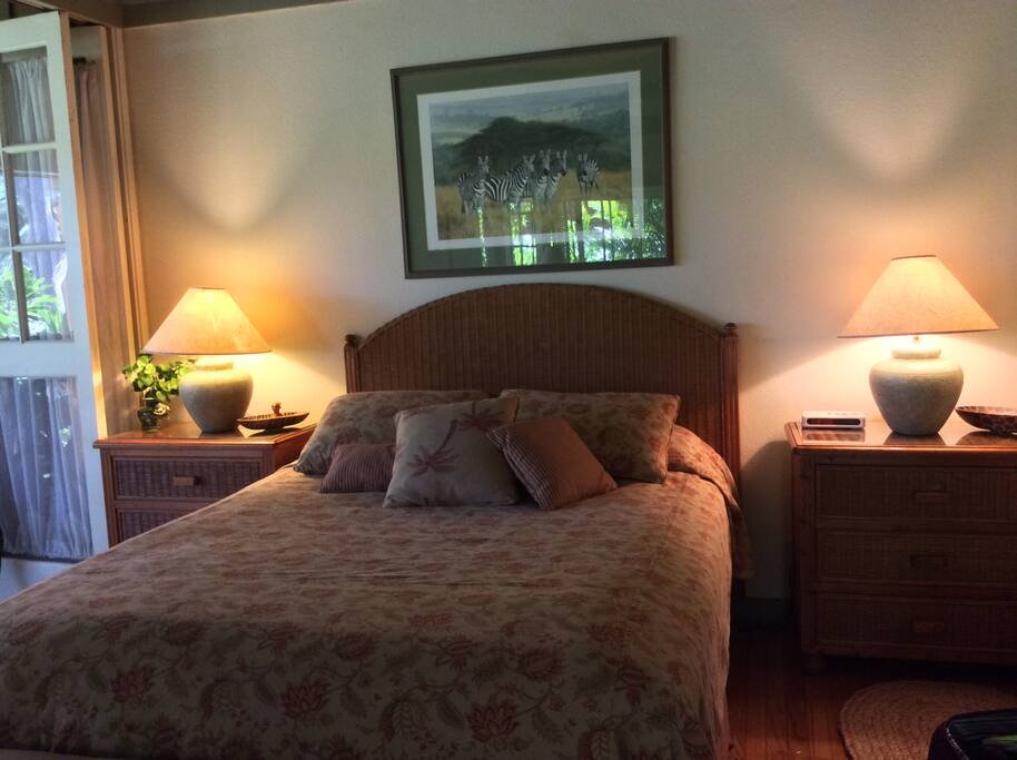 Bedroom with french doors open to the lanai.