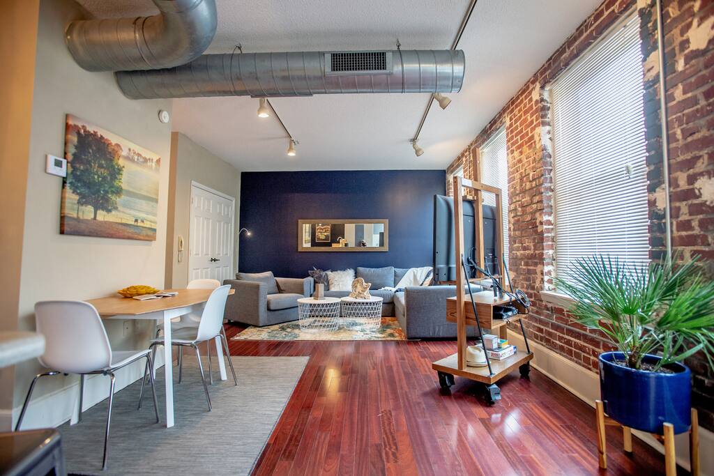Spacious and comfortable living room with open kitchen concept.
