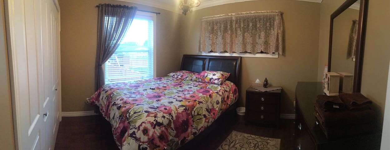 Clean and cozy room in a newly built home.