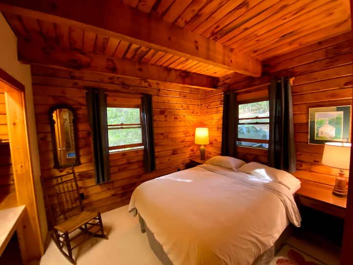 Our downstairs Queen bedroom. There is a closet space to the left, that doubles as a desk in case you need to work in a quieter area.