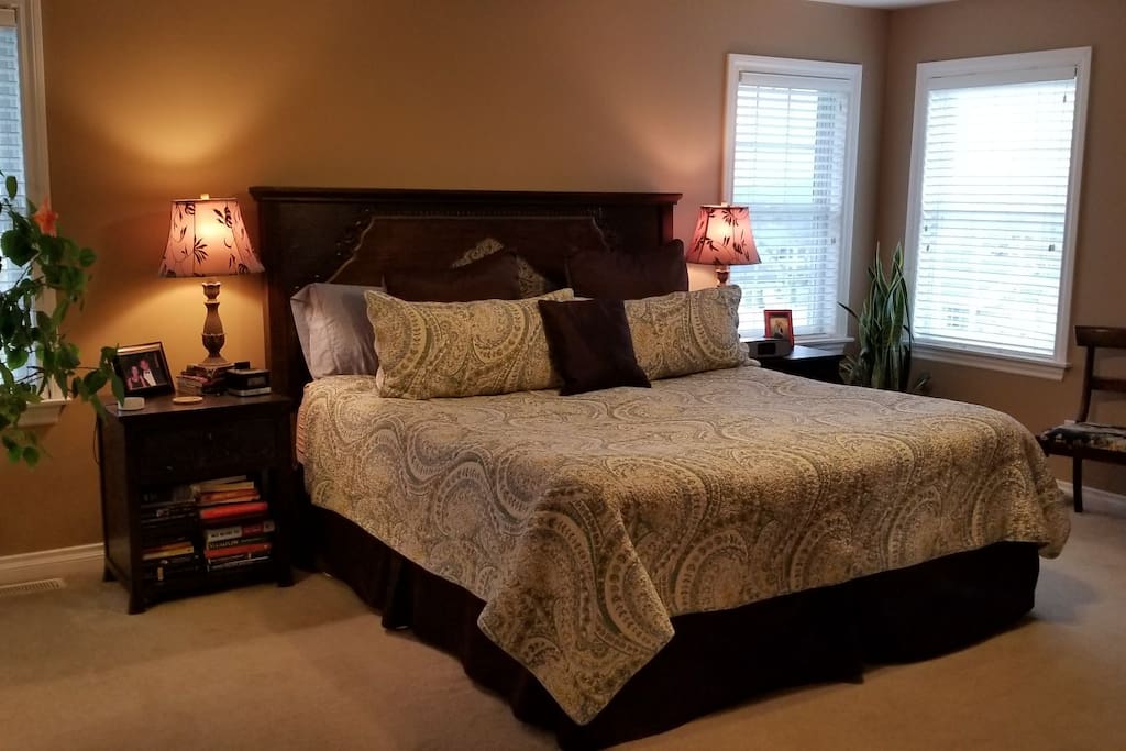 Spacious master bedroom with king and sitting area.