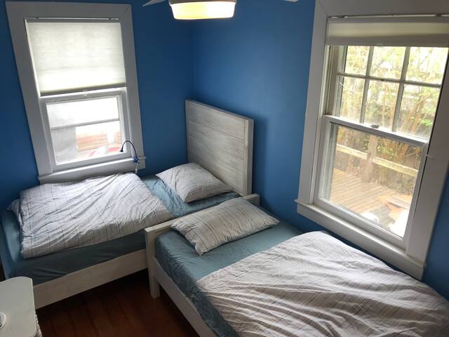 Second bedroom. Two twin beds. Ceiling fan.