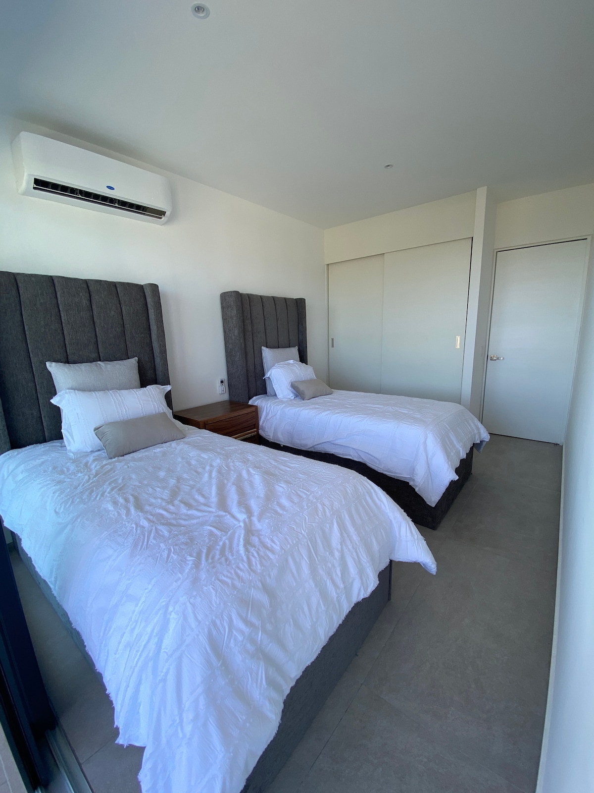 Secondary bedroom with single beds , memory foam mattresses to enjoy more rest and better sleep.