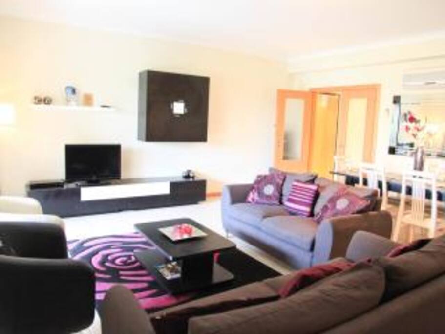 Deluxe Lounge & Dine area overlooks the gardens and swimming pool