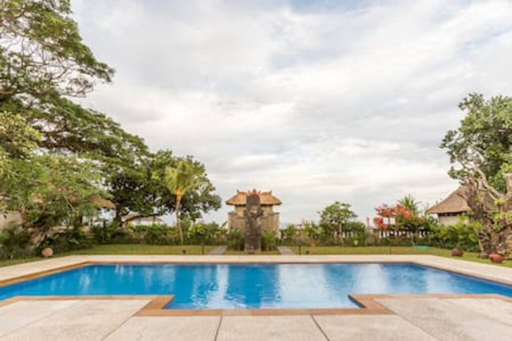 Looking east: Foreground 11-meter pool, beach & Bali Sea on Indian Ocean beyond gardens.