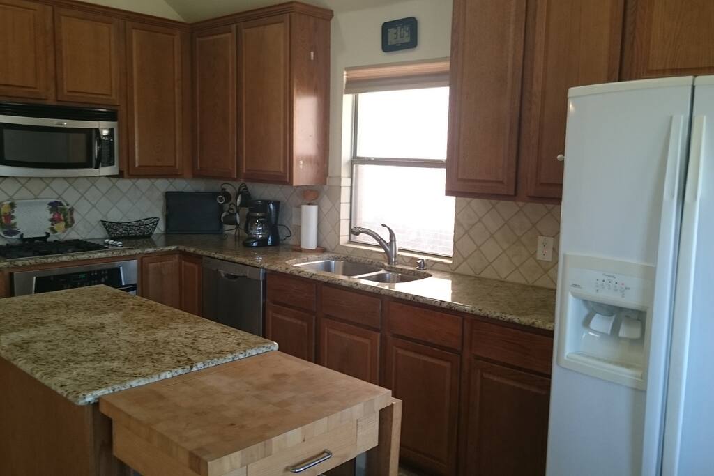 Kitchen with granite countertops and plenty of counter space