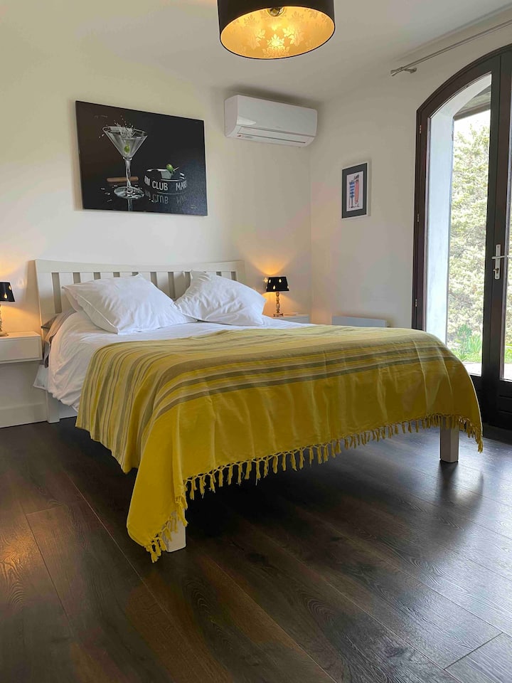 Bedroom 2. Air conditioned. En suite bathroom. Own terrace with direct garden access. Infant cot/bed can be added (by request).