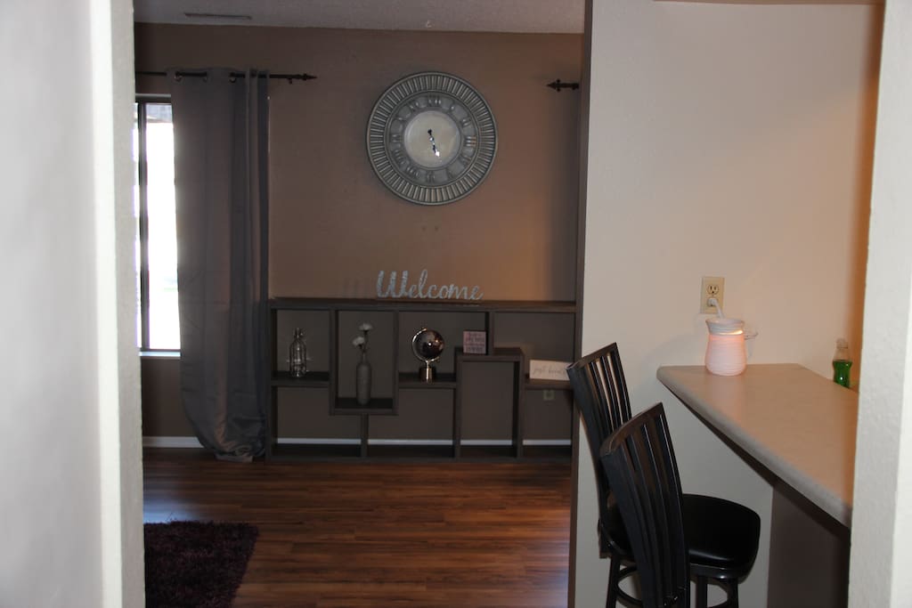 As you come in the main door, you see us "WELCOMING YOU". There is a powder room on your right across from a set of stairs leading to the 2 bedrooms and full bath.