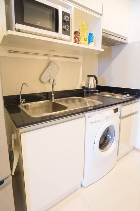 Kitchen area composed of:
1. Electrical stove and pan for light cooking
2. Microwave
3. Refrigerator
4. Thai seasonings
5. Tap water and Drinking water
6. Washing machine
