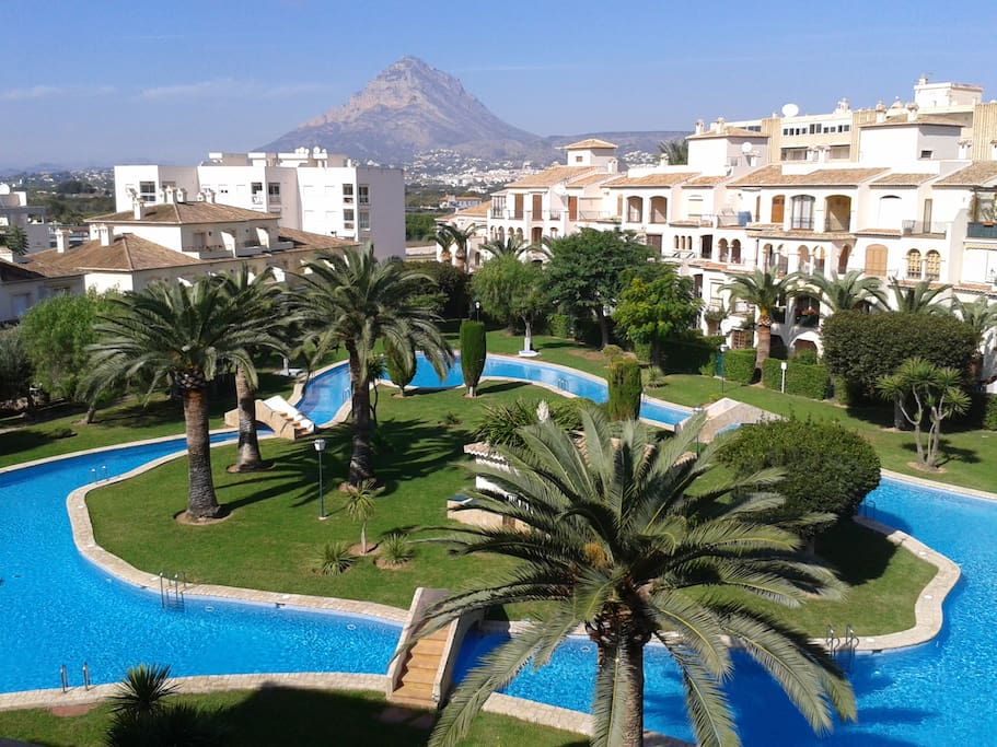 Beautiful gardens and pool surrounding an island