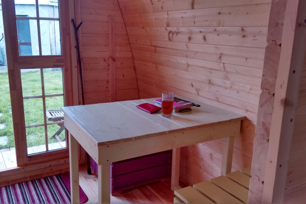 Dining table. Living area furniture can be removed to fit in camp bed for a third person