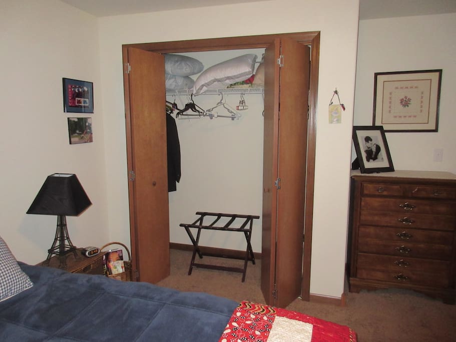 Closet space and stand for suitcase