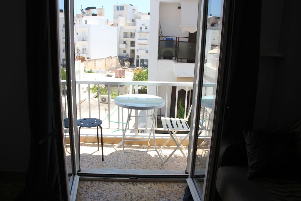 The balcony of the living room with the table and chairs you can use.