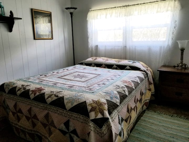 Longspur bedroom with a queen bed.