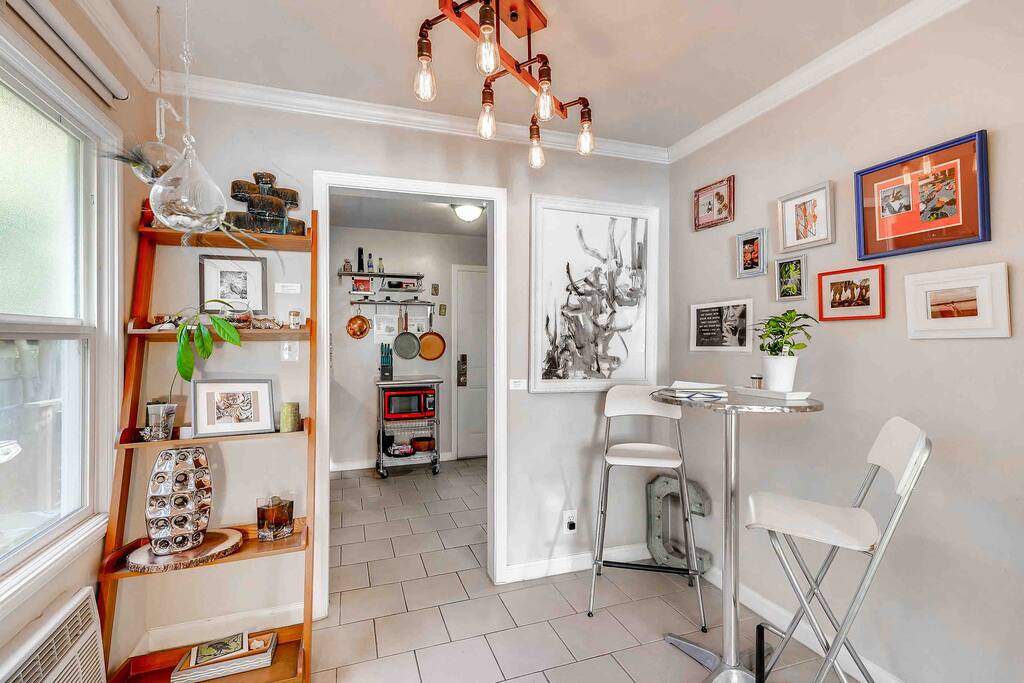 Full kitchen for cooking; and a window seat for dining