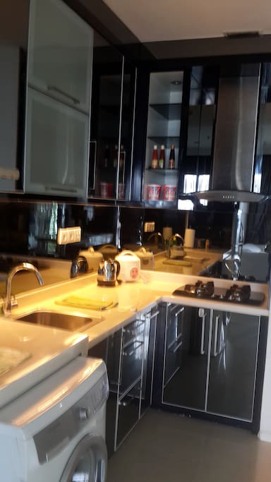 Kitchen with stove, kettle, rice cooker, dining sets, simple cooking sets