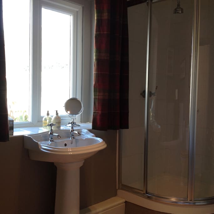 Bathroom with bath and separate shower