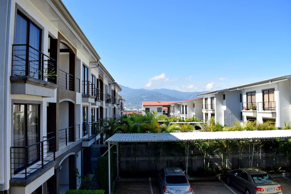Your view from the dining area of the three bedroom (four bed) condo. Those are the green Escazu mountains to the south.