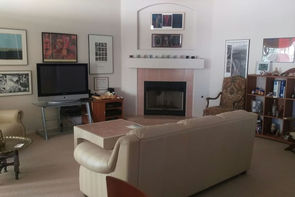 Family room sliding door opens to back yard with bbq.