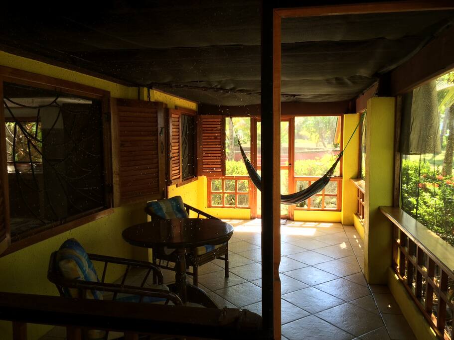 Screened in sitting room with hammock