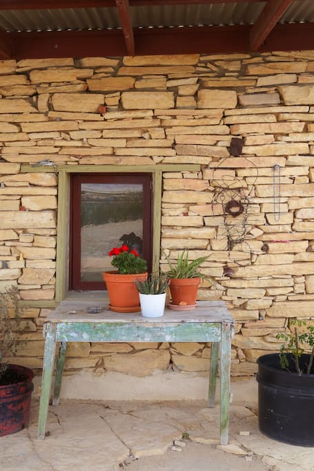 The front porch showing the kitchen window