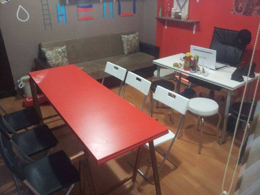 That's the couch which turns into a bed. I only take out the table and chairs for meetings, so they won't be there, taking up space upon your arrival :)