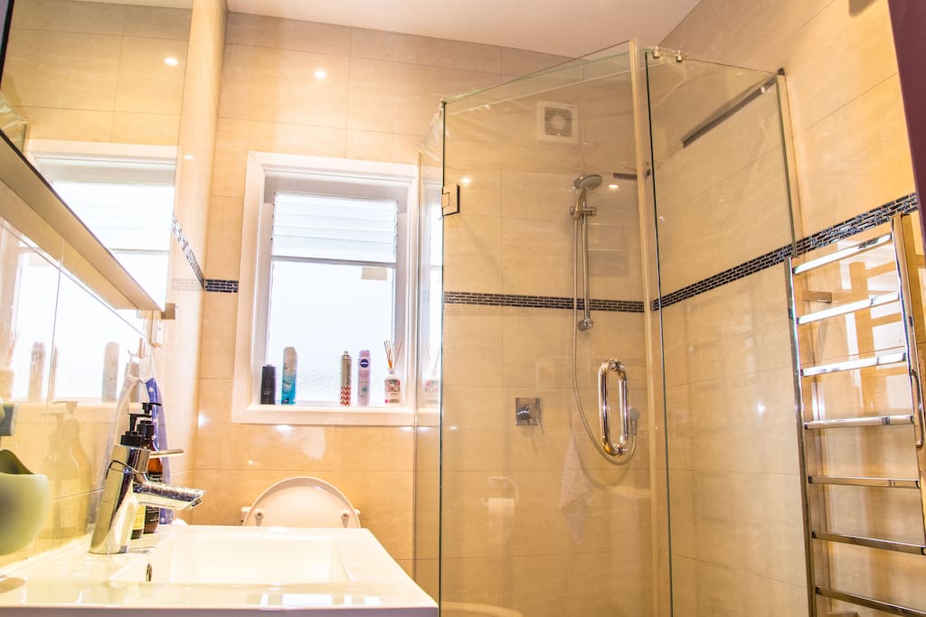 Private modern bathroom (shared with maximum 2 other guests) with heated towel rails and continuous hot water