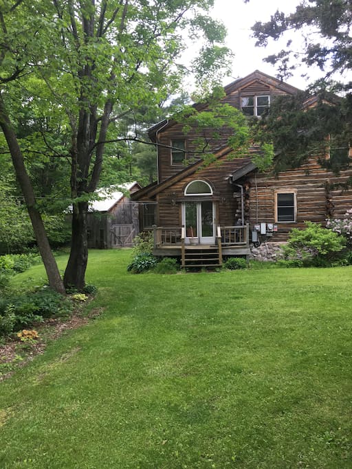 Spacious yard near vegetable garden