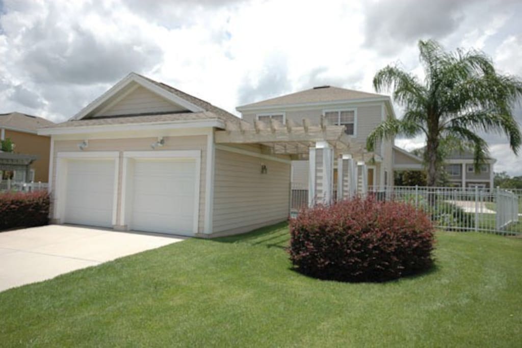 Behind our vacation home you will find ample parking and a double garage surrounded by a beautifully landscaped lawn area.