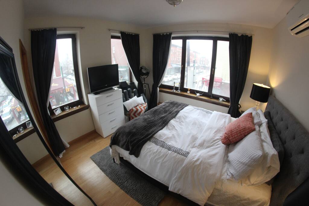 Clean, Modern, and Spacious Bedroom with TV & Private Bathroom